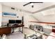 Inviting living room with a modern desk setup, comfortable seating, and stylish decor, creating a versatile living space at 26 E Coral Gables Dr, Phoenix, AZ 85022