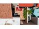 Aerial view showcases patio featuring two red chairs, a privacy hedge, and shade umbrella at 26 E Coral Gables Dr, Phoenix, AZ 85022