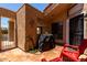Enclosed patio with tiled flooring, BBQ, desert decor, and comfortable outdoor seating at 26 E Coral Gables Dr, Phoenix, AZ 85022