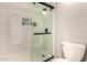 Modern bathroom shower with glass door and tiled surround at 26 E Coral Gables Dr, Phoenix, AZ 85022
