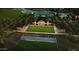 Beautiful community clubhouse surrounded by lush landscaping, a serene pond and a covered picnic area for residents to enjoy at 36049 N Barrel Aged Dr, San Tan Valley, AZ 85140