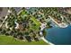 Aerial shot of the community playground with state of the art equipment, set amidst trees and green spaces next to the lake at 36049 N Barrel Aged Dr, San Tan Valley, AZ 85140