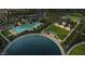 Aerial shot of community pool and lounge area with modern features, surrounded by landscaping and ample seating at 36049 N Barrel Aged Dr, San Tan Valley, AZ 85140