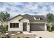 Charming single-story home featuring a neutral color palette, a two-car garage, and desert landscaping for a low-maintenance appeal at 36049 N Barrel Aged Dr, San Tan Valley, AZ 85140