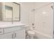 Bright bathroom features a modern vanity with a decorative mirror, plus a shower and tub combination at 3629 E Rochelle Cir, Mesa, AZ 85213
