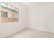 Bright bedroom features white walls, tile flooring and a large window offering plenty of natural light at 3629 E Rochelle Cir, Mesa, AZ 85213