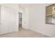 Bedroom features bright walls, tile flooring, closet, and large window at 3629 E Rochelle Cir, Mesa, AZ 85213