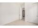 A bright bedroom with white walls, closet, and tiled floors provides a clean and modern space at 3629 E Rochelle Cir, Mesa, AZ 85213