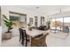 Open concept dining area flows into the living space and features stylish decor and large windows at 3629 E Rochelle Cir, Mesa, AZ 85213