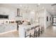 Gorgeous kitchen features a large center island, sleek stainless appliances, and contemporary pendant lighting at 3629 E Rochelle Cir, Mesa, AZ 85213