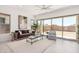 Bright living room offers neutral decor, modern furnishings, and access to the outdoor space at 3629 E Rochelle Cir, Mesa, AZ 85213