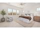 Serene main bedroom with a ceiling fan, natural light, and cozy decor offer a relaxing retreat at 3629 E Rochelle Cir, Mesa, AZ 85213