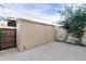 View of the backyard area with a storage shed and privacy wall at 3811 S Mill Ave, Tempe, AZ 85282