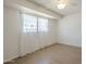 Bright bedroom with a ceiling fan, window, and hardwood floors at 3811 S Mill Ave, Tempe, AZ 85282