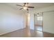 Bedroom featuring hardwood floors, a ceiling fan, closet and large sliding closet doors at 3811 S Mill Ave, Tempe, AZ 85282