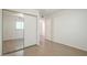 Bedroom featuring hardwood floors, a ceiling fan, closet and a large window at 3811 S Mill Ave, Tempe, AZ 85282