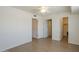 Spacious bedroom featuring bright hardwood floors, ceiling fan and closet doors at 3811 S Mill Ave, Tempe, AZ 85282