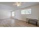 Neutral living room features wood-look floors, two windows and a ceiling fan at 3811 S Mill Ave, Tempe, AZ 85282