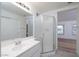 Bathroom featuring glass enclosed shower and single sink vanity at 3956 N 151St Dr, Goodyear, AZ 85395
