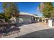 Charming single-story home featuring a well-maintained front yard and attached two-car garage at 3956 N 151St Dr, Goodyear, AZ 85395