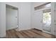 Bright foyer with hardwood floors, natural light, and views to other rooms at 3956 N 151St Dr, Goodyear, AZ 85395