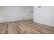 Bright open-concept space with wood-look floors, high ceilings, and abundant natural light at 3956 N 151St Dr, Goodyear, AZ 85395