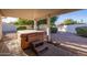 Outdoor patio featuring a spa and desert landscaping at 3956 N 151St Dr, Goodyear, AZ 85395