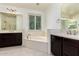 Dual vanity bathroom with a soaking tub at 4167 E Sierra Madre Ave, Gilbert, AZ 85296