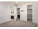 Bright bedroom offering access to a bathroom and walk-in closet with neutral carpet flooring at 4167 E Sierra Madre Ave, Gilbert, AZ 85296