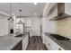 Modern kitchen with stainless appliances, granite counters, and tiled backsplash at 4167 E Sierra Madre Ave, Gilbert, AZ 85296