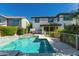 Backyard pool with travertine patio and wrought iron fence surrounding two-story home at 4167 E Sierra Madre Ave, Gilbert, AZ 85296