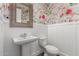 Charming powder room with wainscoting and floral wallpaper at 4167 E Sierra Madre Ave, Gilbert, AZ 85296