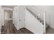 Bright staircase with white railing and wood-look floors at 4167 E Sierra Madre Ave, Gilbert, AZ 85296