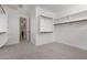 Large walk-in closet with ample storage, featuring carpet flooring and bright white walls at 4167 E Sierra Madre Ave, Gilbert, AZ 85296