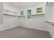 Spacious walk-in closet with built-in shelving and natural light from multiple windows at 4167 E Sierra Madre Ave, Gilbert, AZ 85296