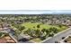 Scenic aerial view of a community park, surrounded by residential houses and green lawns, and many mature trees at 4182 W Park Ave, Chandler, AZ 85226
