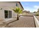 View of the backyard with a sliding door leading to the interior and low-maintenance landscaping at 4182 W Park Ave, Chandler, AZ 85226
