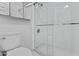 Bathroom featuring glass-enclosed shower and white tile at 4182 W Park Ave, Chandler, AZ 85226