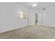 View of a neutral bedroom with light walls with doors to stairs and other rooms at 4182 W Park Ave, Chandler, AZ 85226