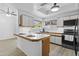Updated kitchen with white cabinets, subway tile backsplash, and modern lighting, perfect for cooking and entertaining at 4182 W Park Ave, Chandler, AZ 85226