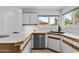Bright kitchen with white cabinets, modern appliances, and a stylish sink area, offering a functional cooking space at 4182 W Park Ave, Chandler, AZ 85226