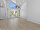 Bright living room with vaulted ceilings, a ceiling fan, and large windows, offering ample natural light and space at 4182 W Park Ave, Chandler, AZ 85226