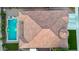High angle view of a brown tiled roof, grassy yard and beautiful aquamarine pool at 4206 E Blue Ridge Pl, Chandler, AZ 85249