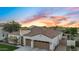 Aerial view showcases a beautiful home with a tile roof, a three-car garage, and well-maintained landscaping at 4206 E Blue Ridge Pl, Chandler, AZ 85249