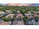 Expansive aerial view of homes with swimming pools, manicured landscaping, and mountain views in the distance at 4206 E Blue Ridge Pl, Chandler, AZ 85249