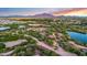 This is a picturesque aerial view of a desert landscape with water features, mountain views and green shrubbery at 4206 E Blue Ridge Pl, Chandler, AZ 85249