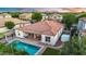 Expansive aerial view showcases a pristine pool, covered patio, and meticulously landscaped backyard at 4206 E Blue Ridge Pl, Chandler, AZ 85249