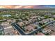 High-angle view features a community with neat landscaping, complemented by a tranquil lake setting at 4206 E Blue Ridge Pl, Chandler, AZ 85249