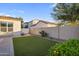 Well-maintained backyard with artificial grass, block wall, and plenty of space for outdoor activities and relaxation at 4206 E Blue Ridge Pl, Chandler, AZ 85249