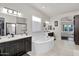 Bright bathroom featuring double sinks, a soaking tub, and elegant fixtures, all complemented by natural light at 4206 E Blue Ridge Pl, Chandler, AZ 85249